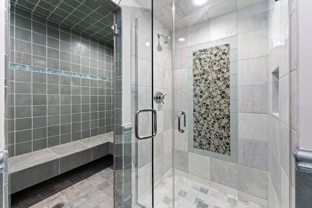bathroom featuring a shower stall