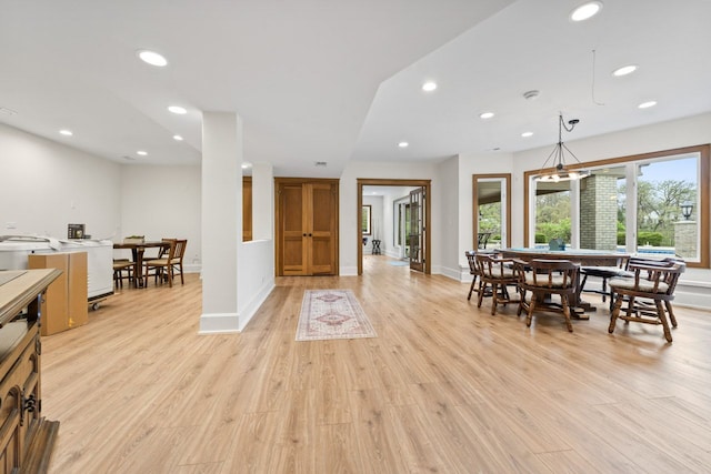 dining room with baseboards, light wood-style floors, french doors, and recessed lighting
