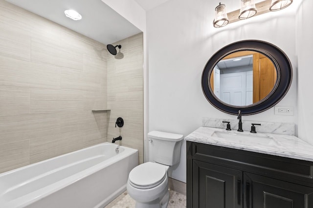 full bathroom with toilet, baseboards, vanity, and shower / washtub combination