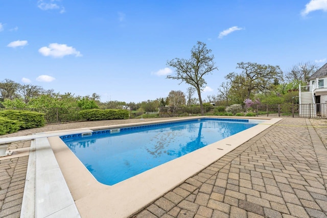 view of pool featuring fence, a fenced in pool, and a patio area