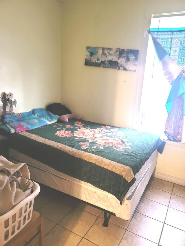 bedroom featuring tile patterned flooring