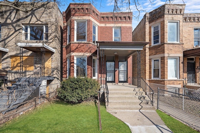 view of front facade with brick siding and fence