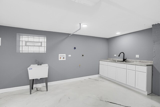 laundry area with cabinet space, baseboards, a sink, and hookup for a washing machine