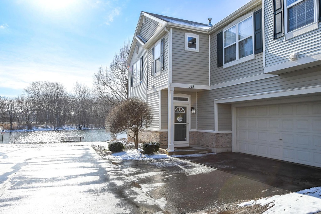 618 Arbor Cir Unit 0, Lakemoor, IL 60051 - exterior space with aphalt driveway, brick siding, and an attached garage