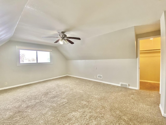 351 Clyde Ave, Calumet City, IL 60409 - additional living space featuring visible vents, a ceiling fan, carpet flooring, and vaulted ceiling