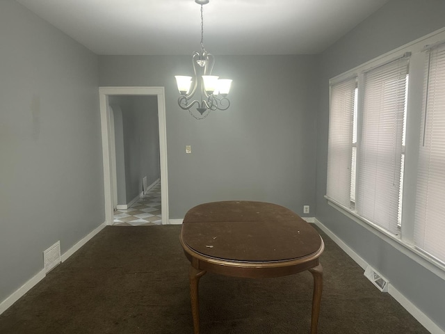 651 Douglas Ave, Calumet City, IL 60409 - carpeted dining space with visible vents, baseboards, and an inviting chandelier