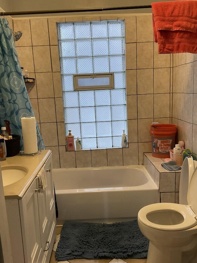 651 Douglas Ave, Calumet City, IL 60409 - bathroom with vanity, tile patterned floors, toilet, shower / bathtub combination with curtain, and tile walls
