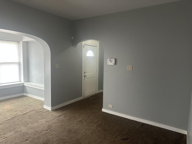 651 Douglas Ave, Calumet City, IL 60409 - carpeted spare room with arched walkways and baseboards