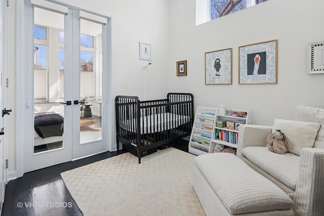 bedroom featuring wood finished floors and french doors
