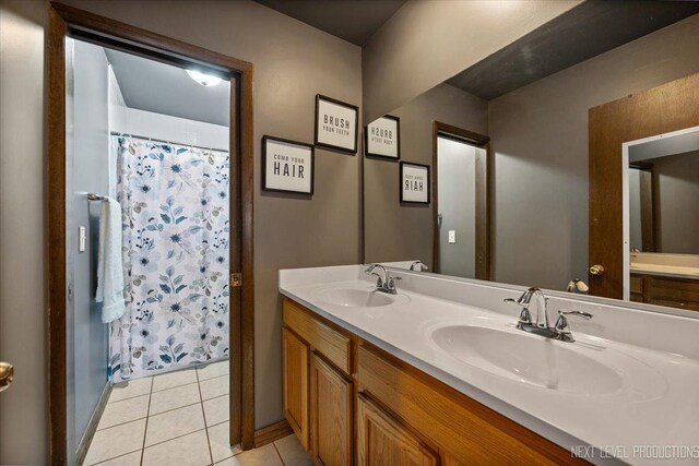 602 S Vista Dr, Algonquin, IL 60102 - bathroom featuring double vanity, tile patterned floors, and a shower with curtain