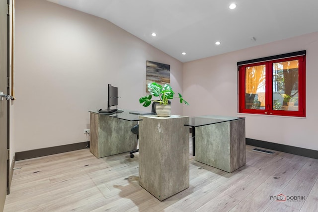 office area with baseboards, visible vents, lofted ceiling, recessed lighting, and light wood-type flooring