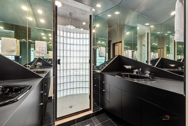 full bathroom featuring granite finish floor, recessed lighting, tiled shower, and vanity