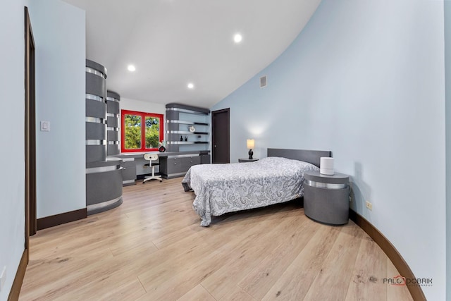 bedroom with lofted ceiling, recessed lighting, baseboards, and light wood-type flooring