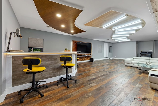 bar with visible vents, recessed lighting, baseboards, and wood-type flooring