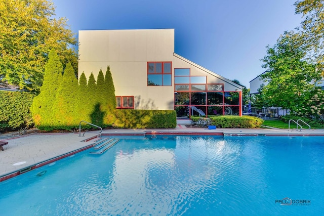 pool with a patio area