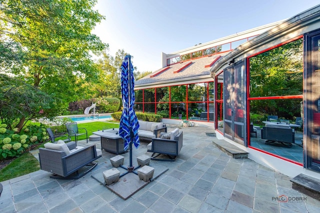 view of patio featuring an outdoor pool and an outdoor hangout area