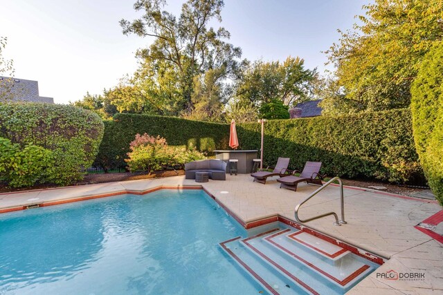 view of pool featuring a fenced in pool, a patio, and a fenced backyard