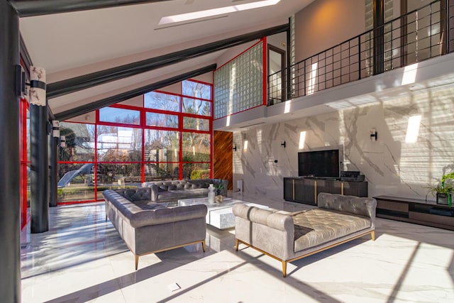 living room with marble finish floor and a high ceiling