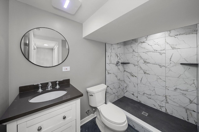 3012 N Knox Ave, Chicago, IL 60641 - bathroom featuring tiled shower, toilet, vanity, and baseboards