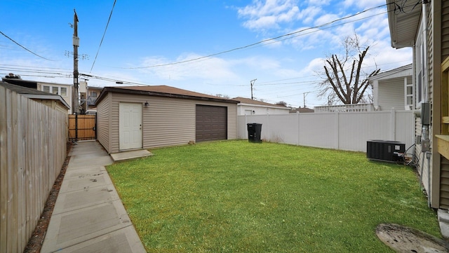 3012 N Knox Ave, Chicago, IL 60641 - view of yard featuring a fenced backyard, a garage, central AC unit, and an outdoor structure