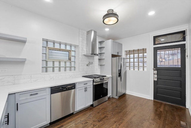 3012 N Knox Ave, Chicago, IL 60641 - kitchen featuring dark wood finished floors, open shelves, wall chimney range hood, and appliances with stainless steel finishes