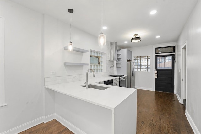 3012 N Knox Ave, Chicago, IL 60641 - kitchen with a sink, dark wood finished floors, stainless steel appliances, wall chimney exhaust hood, and open shelves