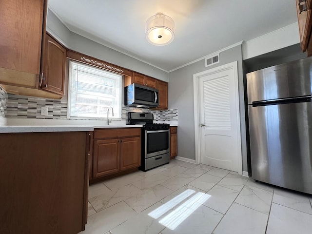 kitchen with light countertops, stainless steel appliances, backsplash, marble finish floor, and visible vents