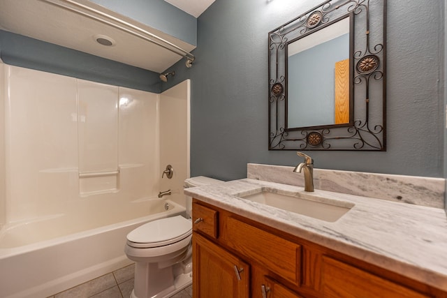 bathroom with tile patterned floors, shower / bathtub combination, vanity, and toilet