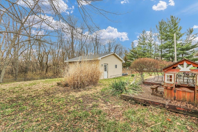 view of yard with an outdoor structure and fence