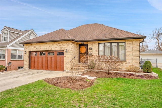 view of front facade with brick siding, a shingled roof, a garage, and concrete driveway
