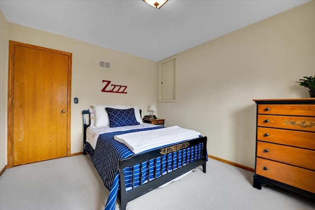 bedroom featuring visible vents, baseboards, and carpet floors