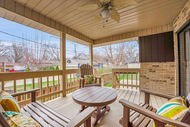 wooden terrace with a ceiling fan