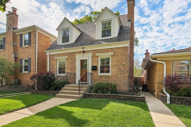 5842 N Kingsdale Ave, Chicago, IL 60646 - cape cod home featuring a shingled roof, brick siding, and a chimney