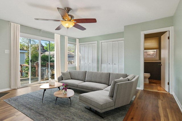 5842 N Kingsdale Ave, Chicago, IL 60646 - living area with ceiling fan, baseboards, and wood finished floors