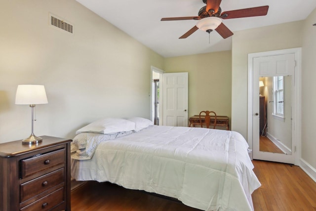 5842 N Kingsdale Ave, Chicago, IL 60646 - bedroom featuring wood finished floors, baseboards, and ceiling fan