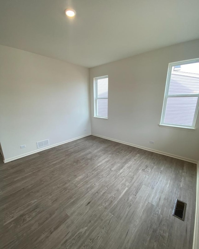 32004 Savannah Dr, Lakemoor, IL 60051 - unfurnished room with dark wood-type flooring and baseboards