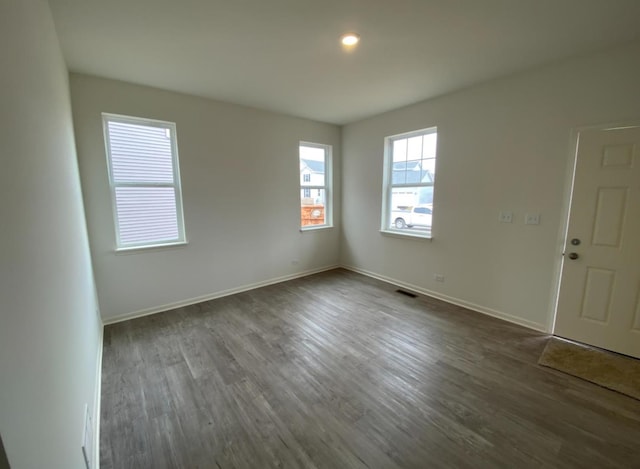 32004 Savannah Dr, Lakemoor, IL 60051 - empty room with dark wood-style flooring and recessed lighting