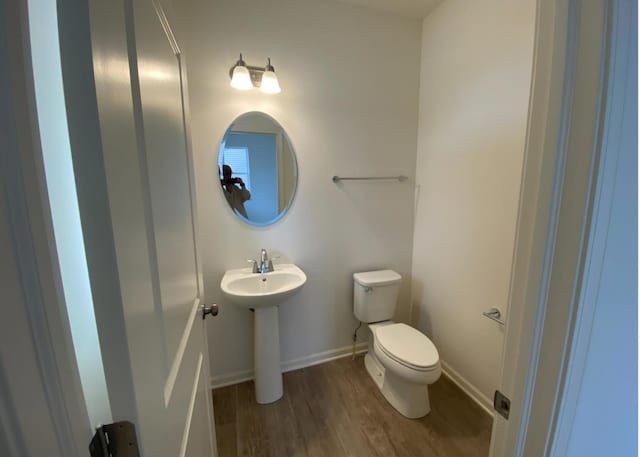 32004 Savannah Dr, Lakemoor, IL 60051 - half bathroom featuring toilet and wood finished floors