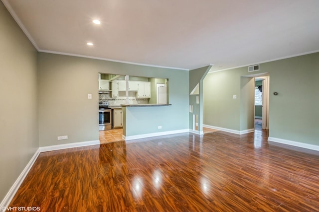 675 Grove Dr Unit 204, Elk Grove Village, IL 60007 - unfurnished living room with visible vents, ornamental molding, wood finished floors, and recessed lighting