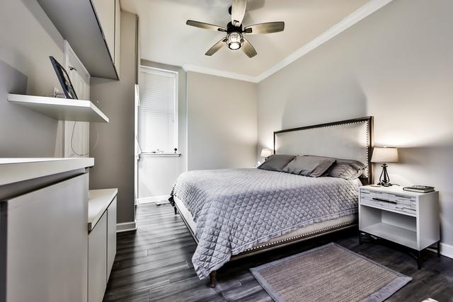 1500 N Lasalle Dr Unit 5B, Chicago, IL 60610 - bedroom with dark wood-style floors, baseboards, ornamental molding, and a ceiling fan