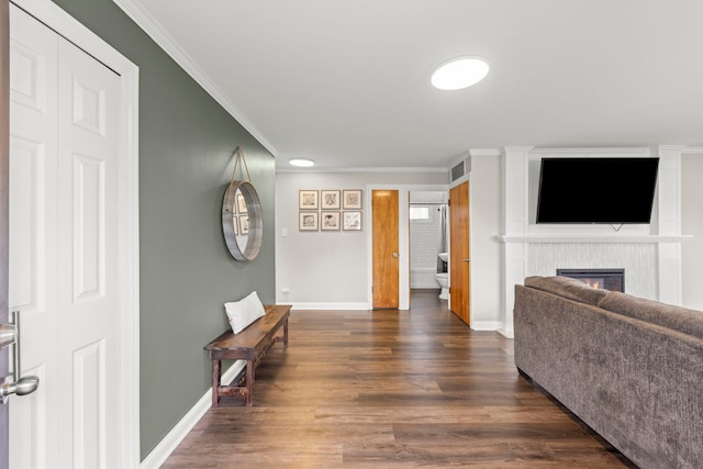 4N210 Norris Ave, West Chicago, IL 60185 - living area featuring a glass covered fireplace, baseboards, dark wood-type flooring, and crown molding