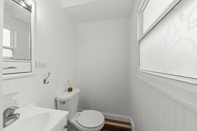 4N210 Norris Ave, West Chicago, IL 60185 - half bath featuring baseboards, wood finished floors, toilet, and vanity