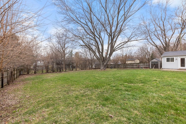 4N210 Norris Ave, West Chicago, IL 60185 - view of yard with a fenced backyard, an outdoor structure, and a shed