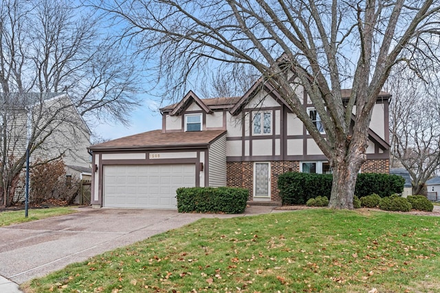 tudor home featuring stucco siding, driveway, a front yard, a garage, and brick siding
