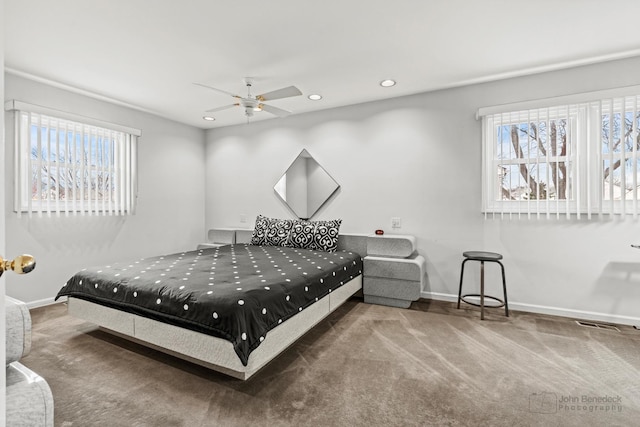 carpeted bedroom featuring visible vents, recessed lighting, baseboards, and ceiling fan