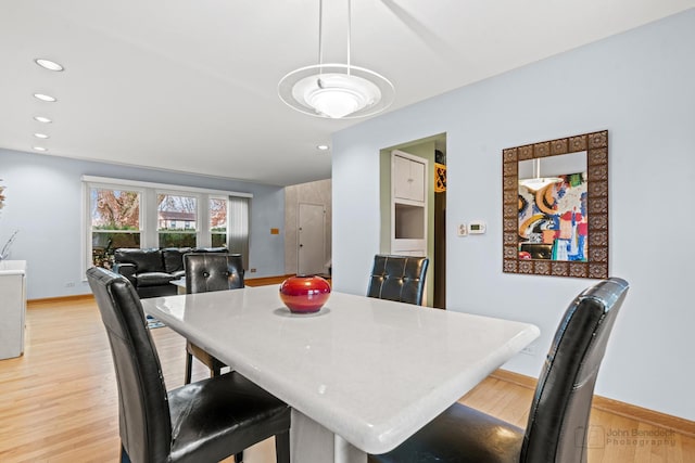 dining area with recessed lighting, baseboards, and light wood-style floors