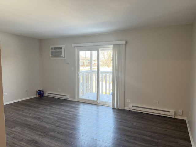 2356 Gaylord Rd Unit 2D, Crest Hill, IL 60403 - spare room with a baseboard heating unit, a wall mounted AC, dark wood-style floors, and baseboards