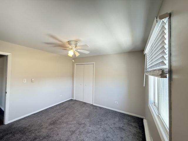 2356 Gaylord Rd Unit 2D, Crest Hill, IL 60403 - unfurnished bedroom featuring dark carpet, baseboards, a closet, and ceiling fan