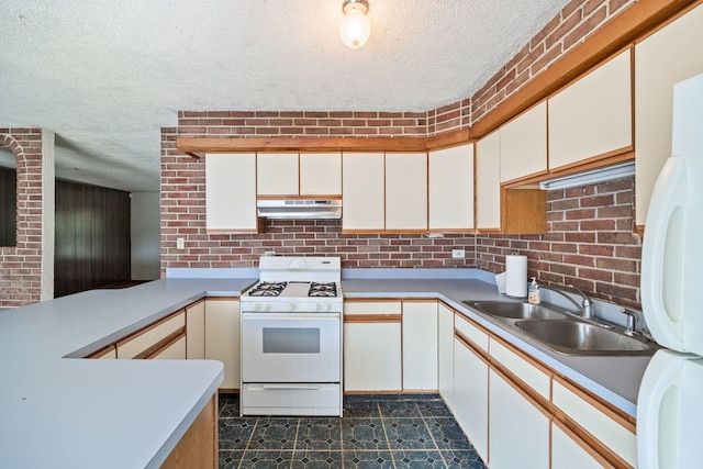 17433 Appletree Dr, Hazel Crest, IL 60429 - kitchen featuring white appliances, under cabinet range hood, a textured ceiling, light countertops, and white cabinetry