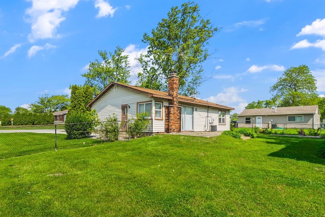 17433 Appletree Dr, Hazel Crest, IL 60429 - view of front facade featuring a fenced backyard and a chimney